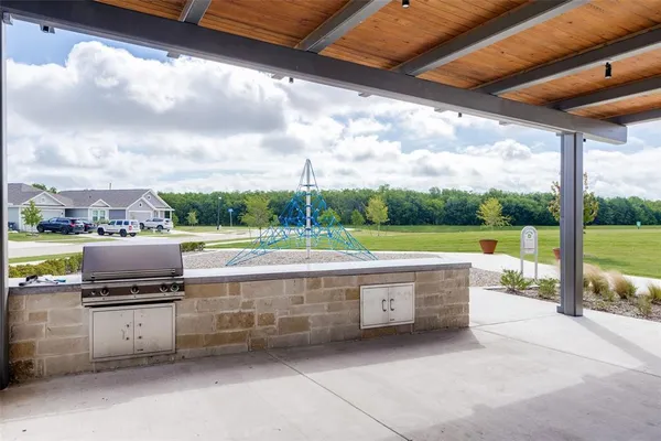 a view of swimming pool with a patio
