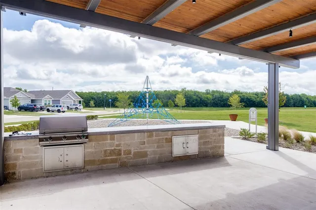 a view of swimming pool with a patio