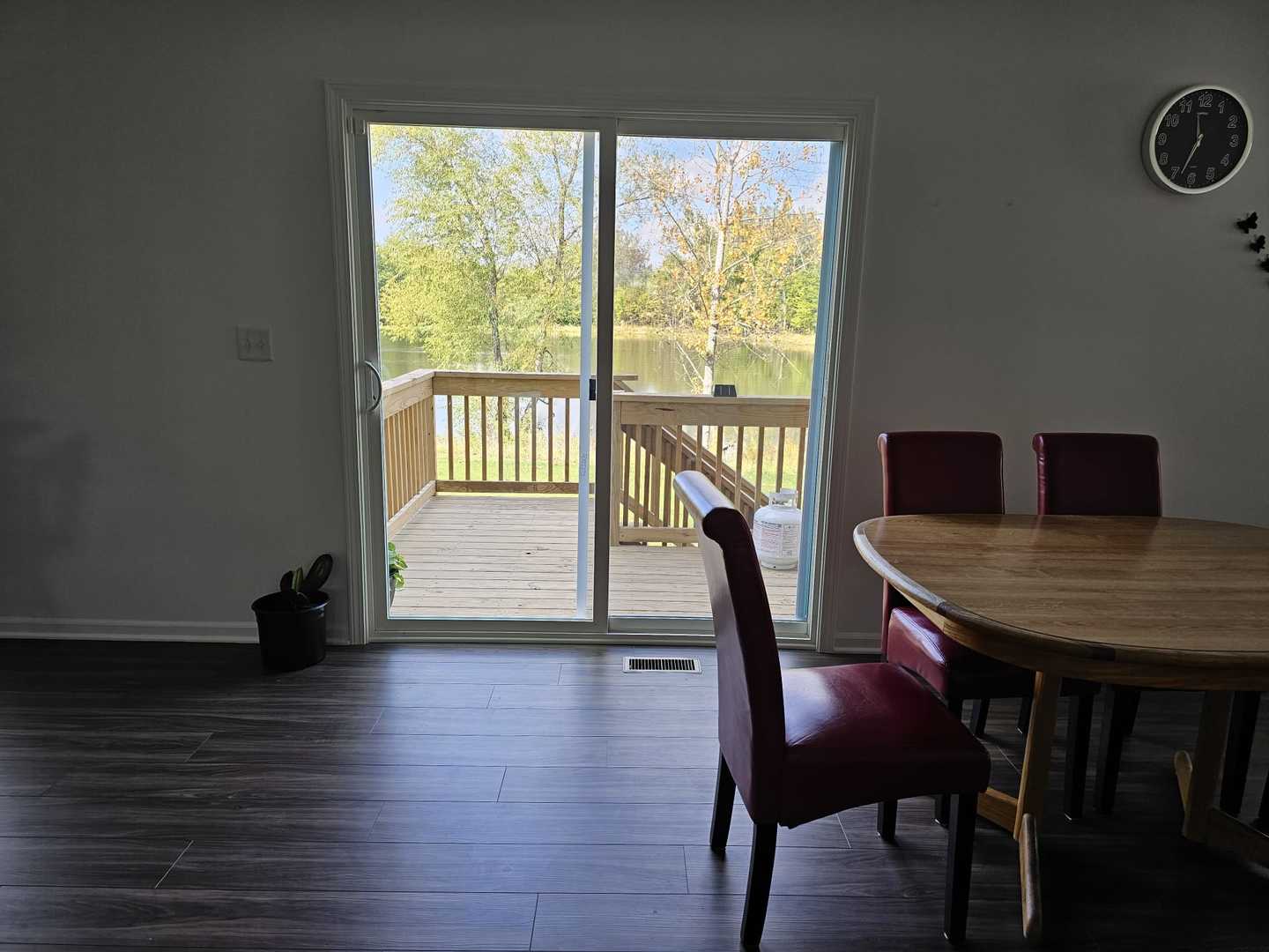 81 Sweetflag Circle Elgin, IL 60124 - Photo 3 of 9 a view of a dining room with furniture window and wooden floor