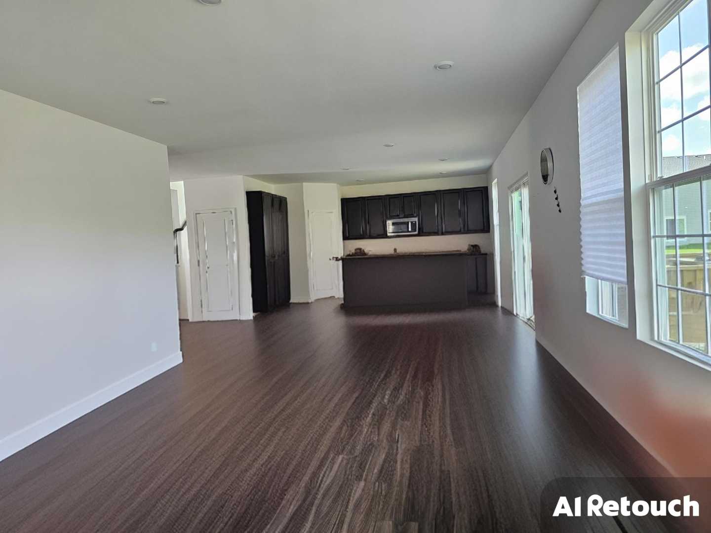 81 Sweetflag Circle Elgin, IL 60124 - Photo 4 of 9 a view of a kitchen with wooden floor and a refrigerator