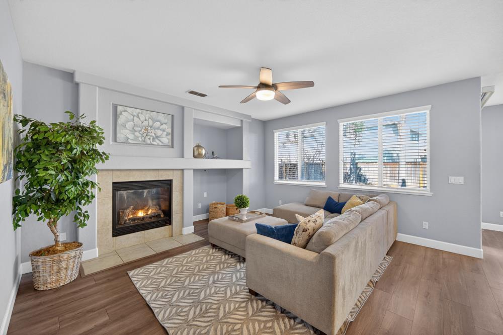 3045 Delta Tule Way Sacramento, CA 95834 - Photo 11 of 65 a living room with furniture and a fireplace