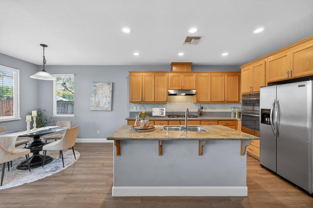 3045 Delta Tule Way Sacramento, CA 95834 - Photo 14 of 65 a dining table with chairs and window