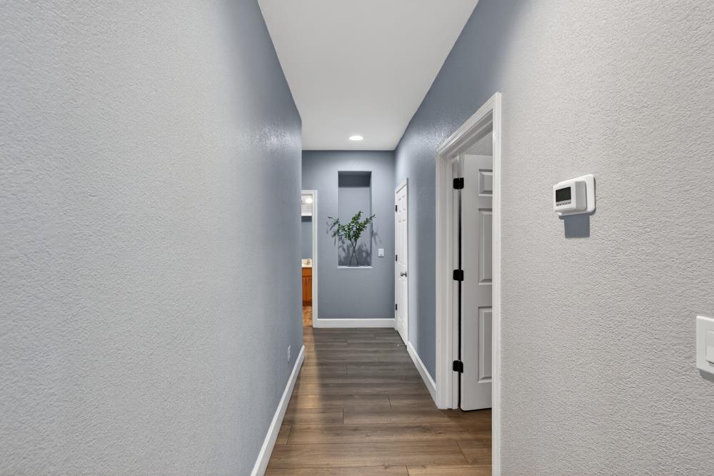 3045 Delta Tule Way Sacramento, CA 95834 - Photo 20 of 65 a view of a hallway with wooden floor and staircase
