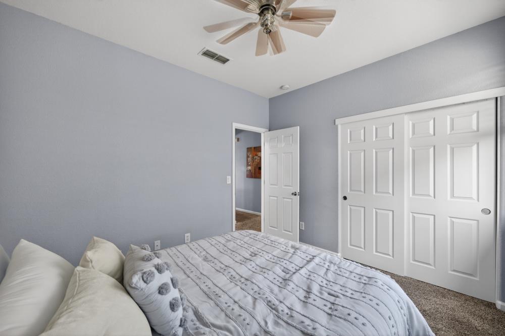 3045 Delta Tule Way Sacramento, CA 95834 - Photo 39 of 65 a bedroom with a bed and cabinets
