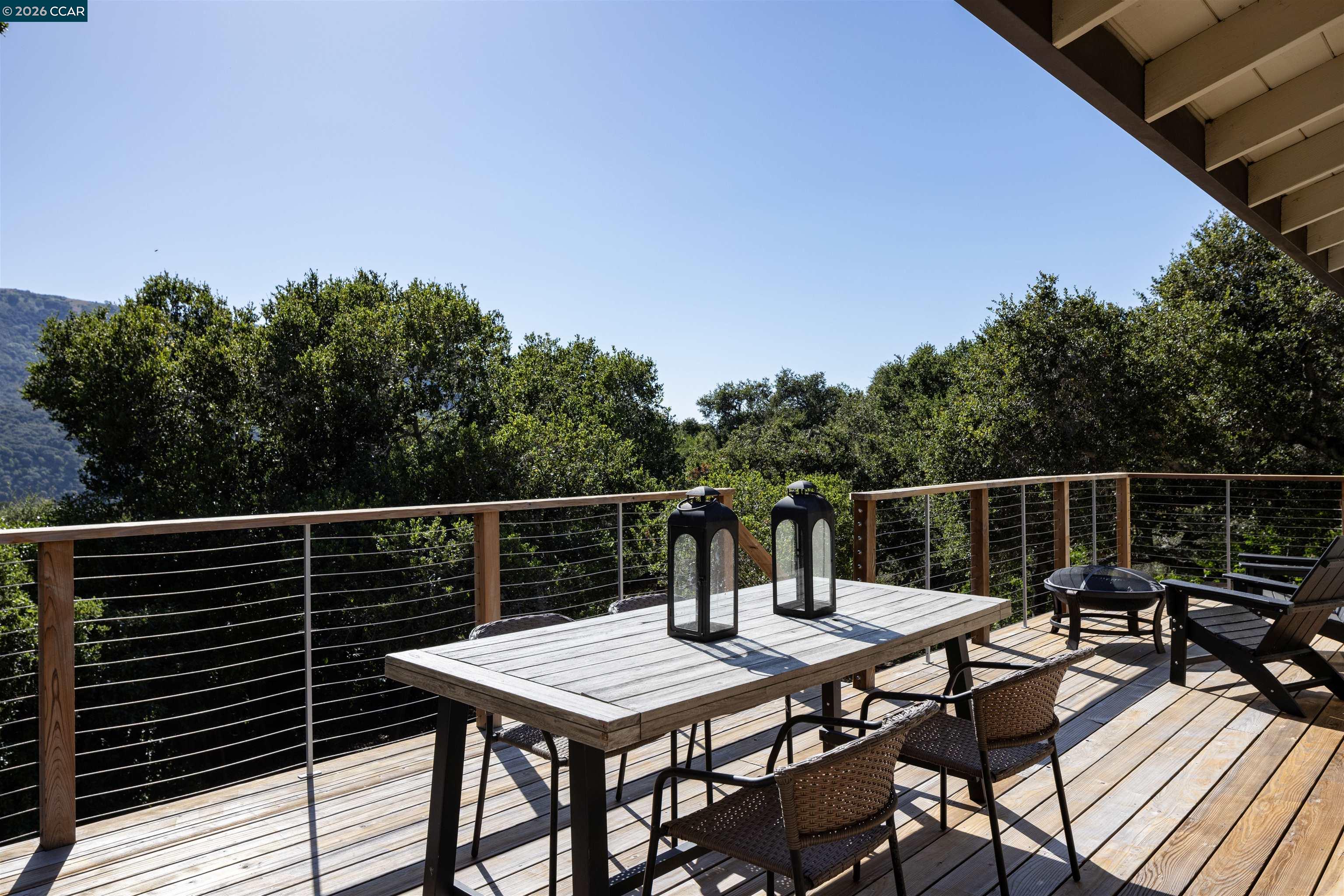 12 Marquard Road Carmel Valley, CA 93924 - Photo 28 of 36 a terrace with outdoor seating and wooden floor