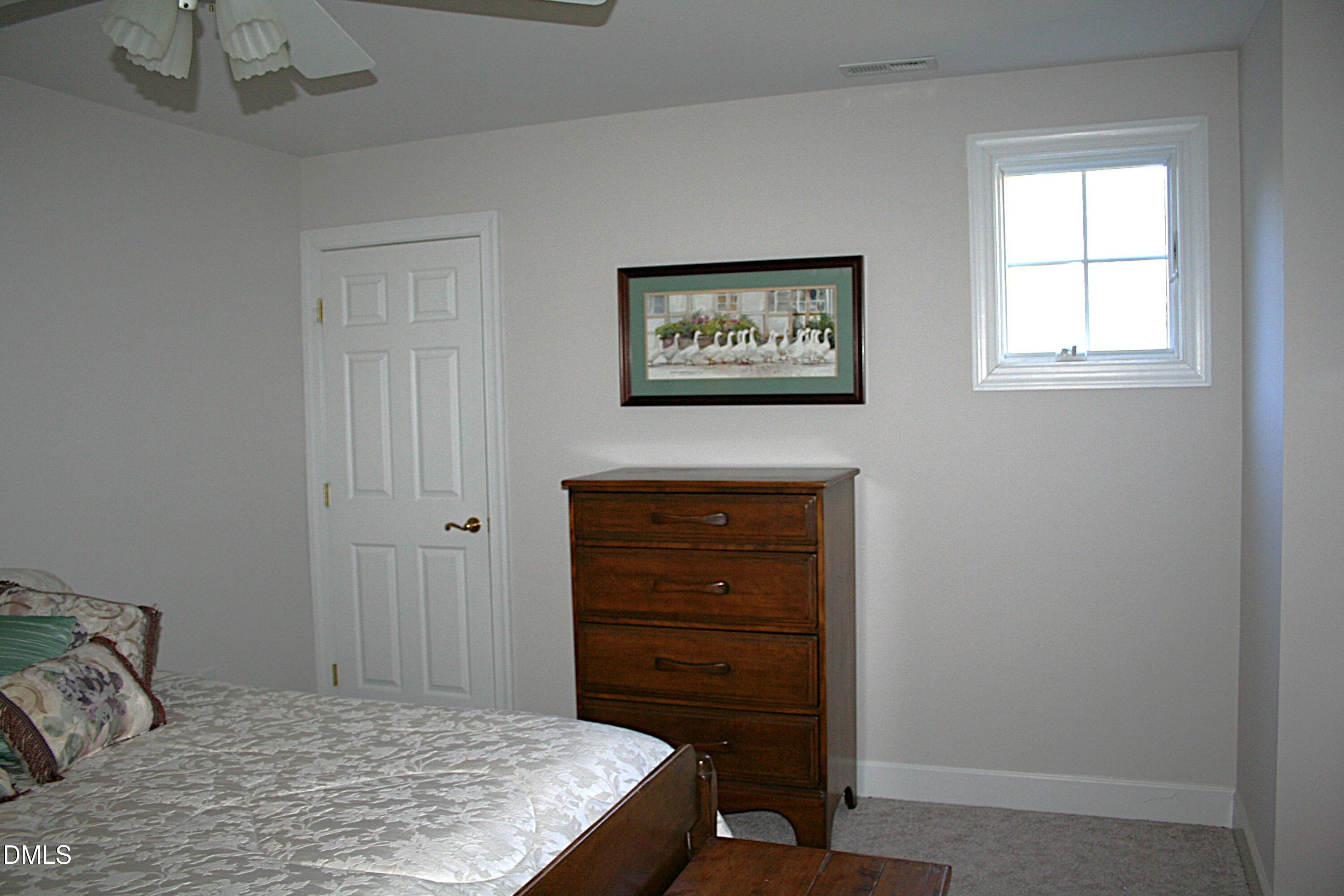 220 Jordan Narron Road Selma, NC 27576 - Photo 44 of 87 a room with a bed and a window