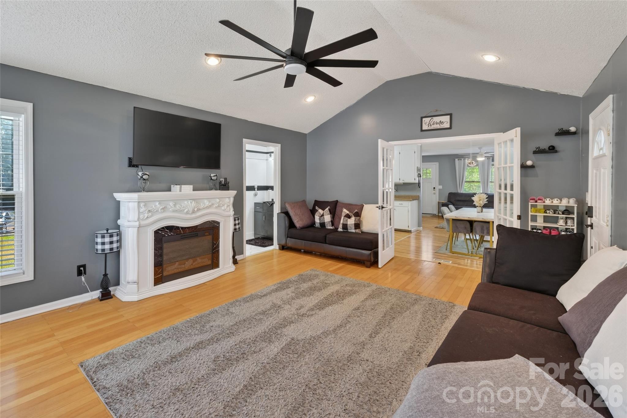 1704 Williams Circle Lancaster, SC 29720 - Photo 12 of 19 a living room with furniture a flat screen tv and a fireplace
