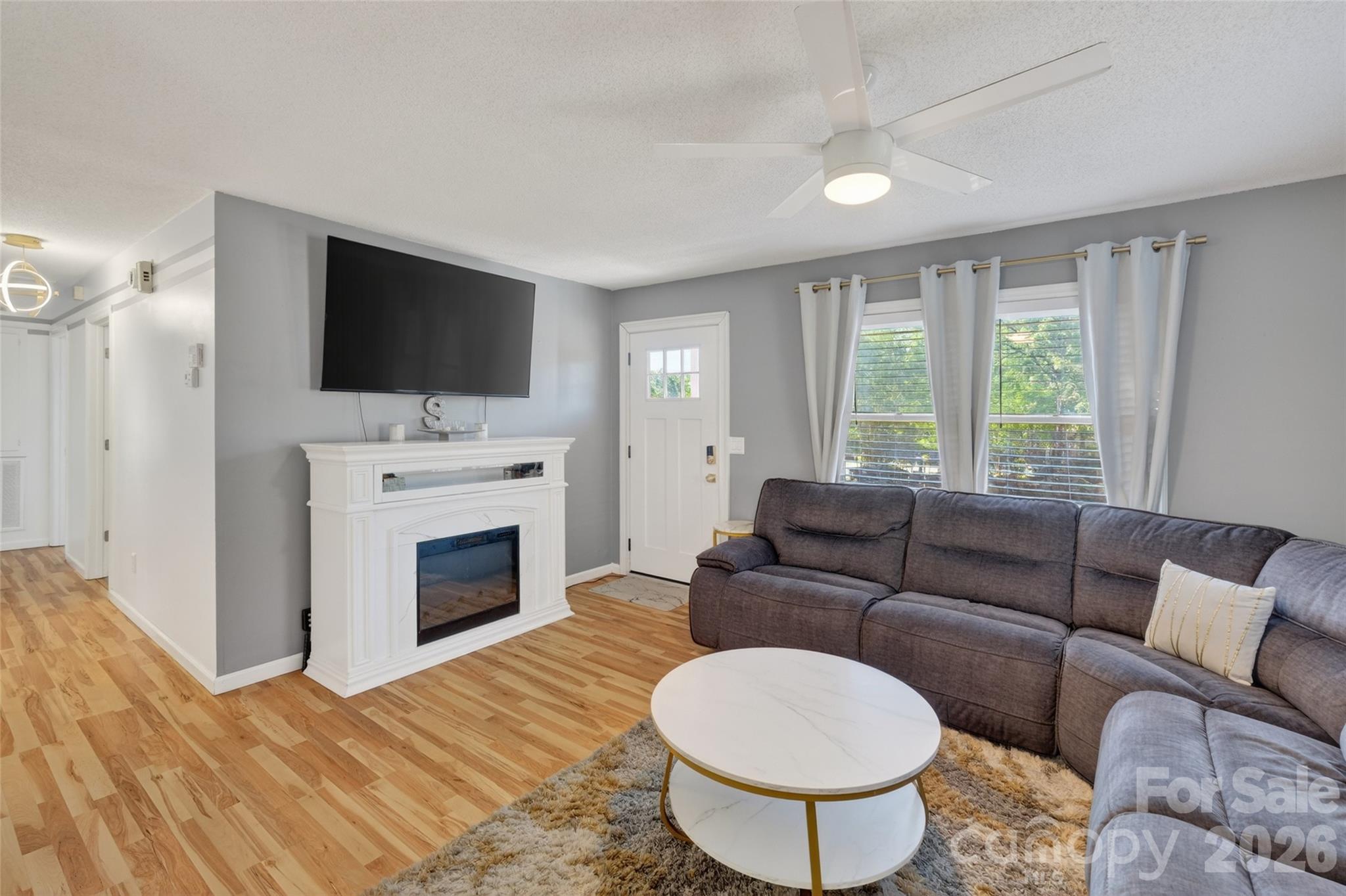 1704 Williams Circle Lancaster, SC 29720 - Photo 5 of 19 a living room with furniture a fireplace and a flat screen tv