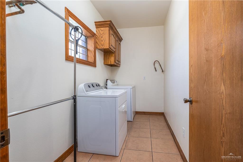 738 County Road 137 Alice, TX 78332 - Photo 17 of 33 a bathroom with a sink a mirror and shower