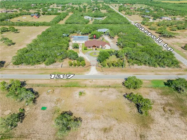 an aerial view of beach and lake