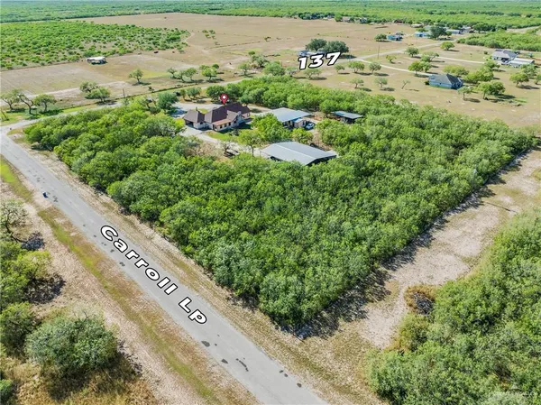an aerial view of residential house with outdoor space