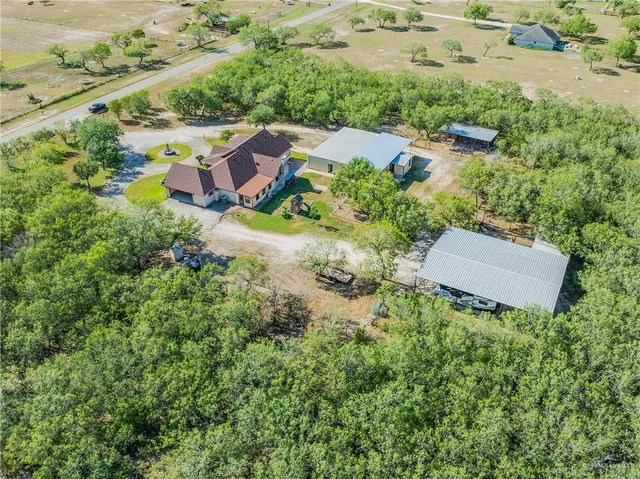 an aerial view of residential house with outdoor space