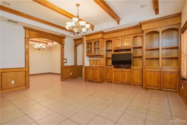 a view of a livingroom with furniture and chandelier