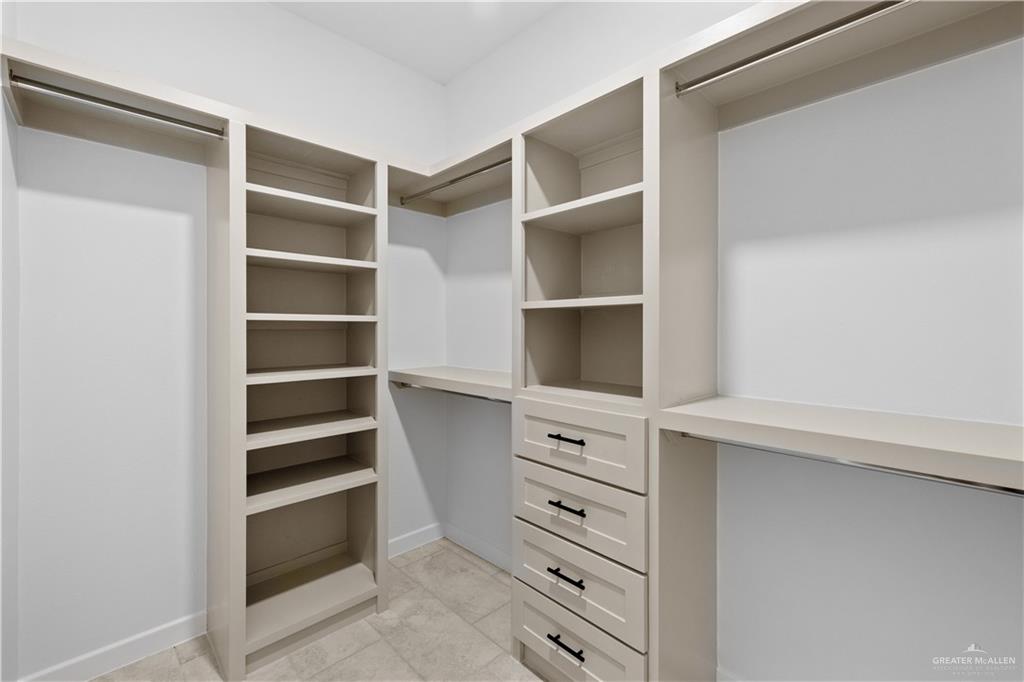 2713 East Comal Road Edinburg, TX 78542 - Photo 17 of 29 a view of walk in closet with empty racks