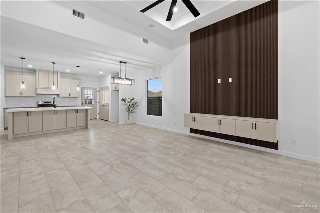 2713 East Comal Road Edinburg, TX 78542 - Photo 5 of 29 a view of a kitchen with a sink and cabinets