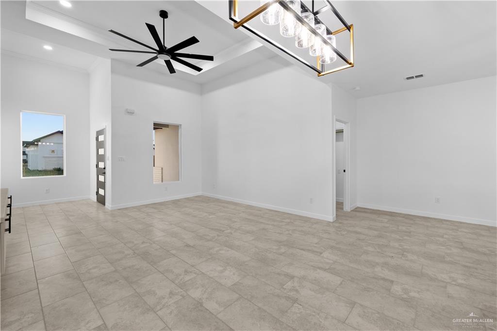 2713 East Comal Road Edinburg, TX 78542 - Photo 7 of 29 a view of a livingroom with a ceiling fan and window
