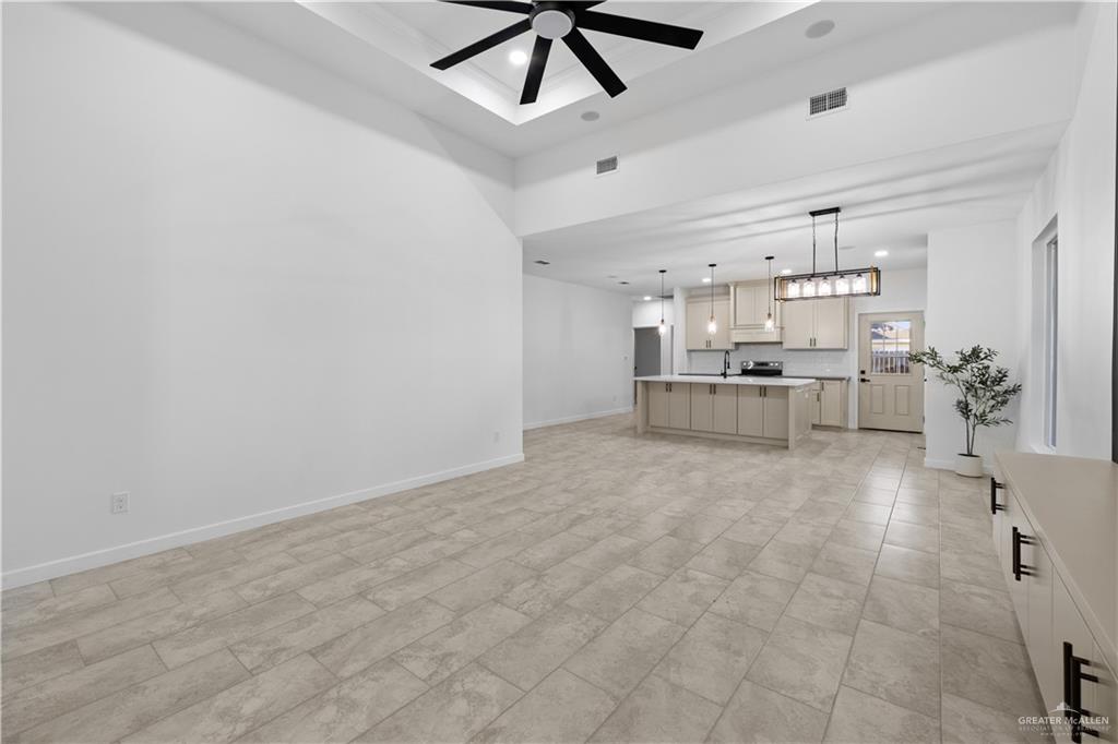 2713 East Comal Road Edinburg, TX 78542 - Photo 8 of 29 a view of kitchen and livingroom with furniture