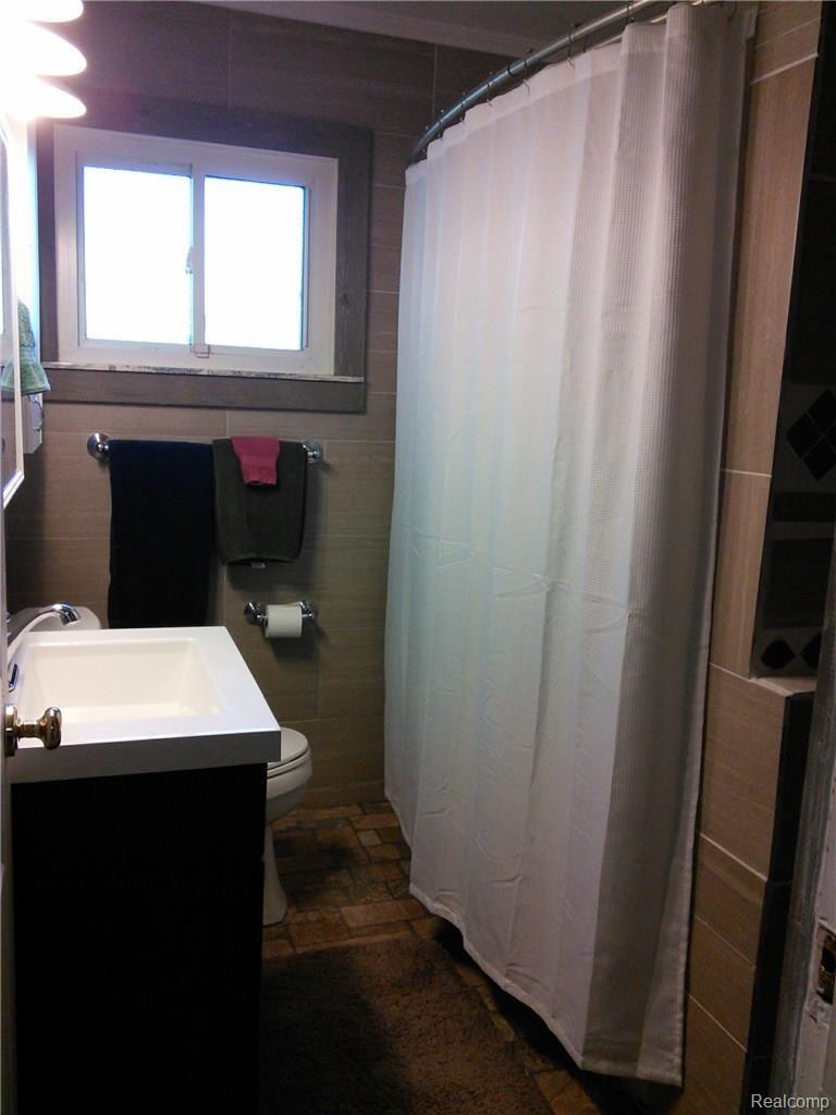 4400 Van Slyke Road Flint, MI 48507 - Photo 15 of 26 Updated bathroom