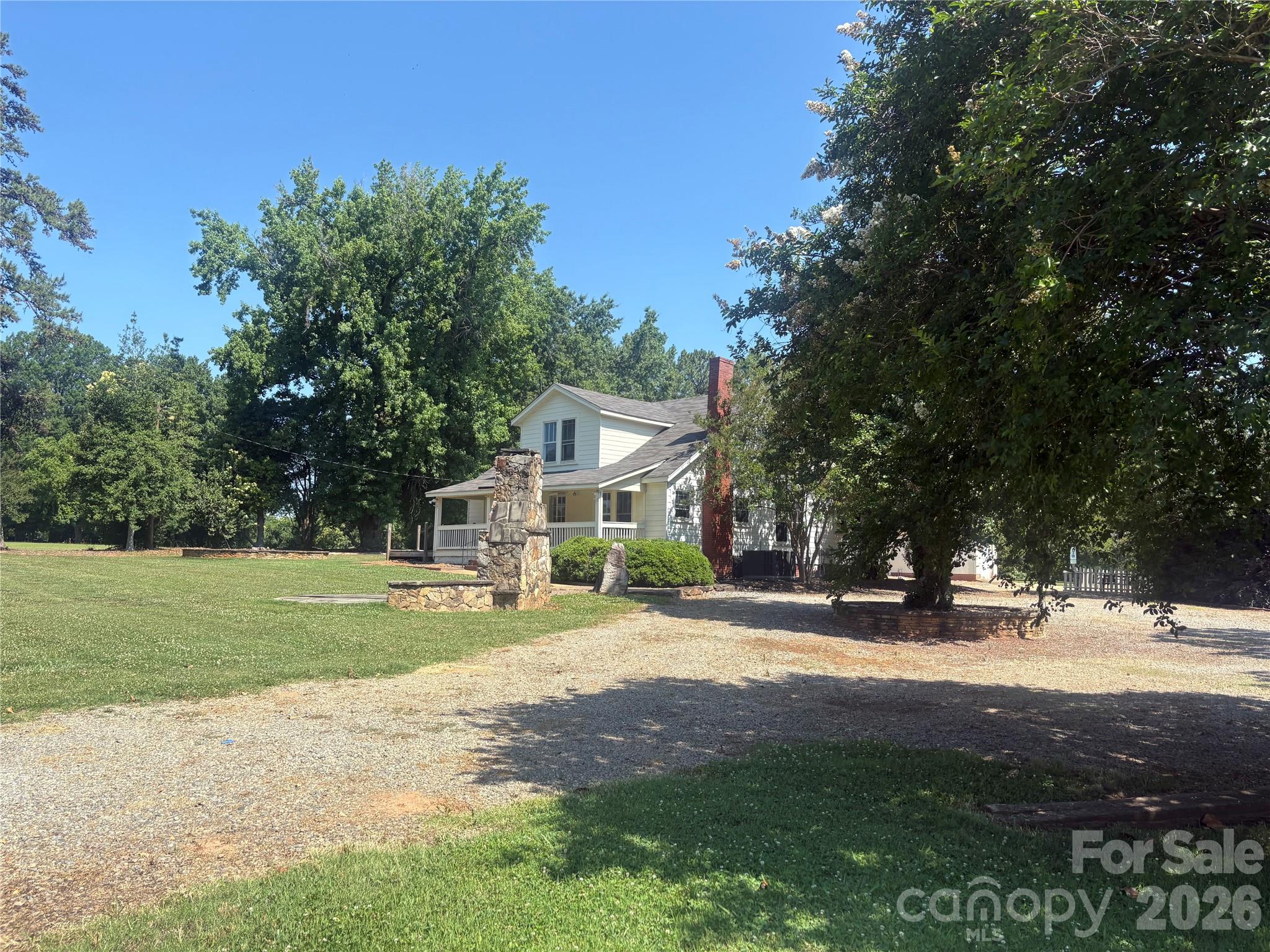 16024 Davidson-Concord Road Davidson, NC 28036 - Photo 2 of 4 a view of a house with a yard