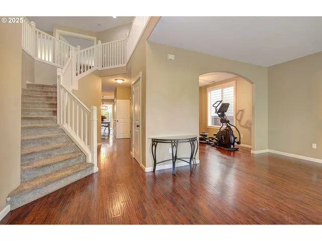 a view of a livingroom with wooden floor and a couch