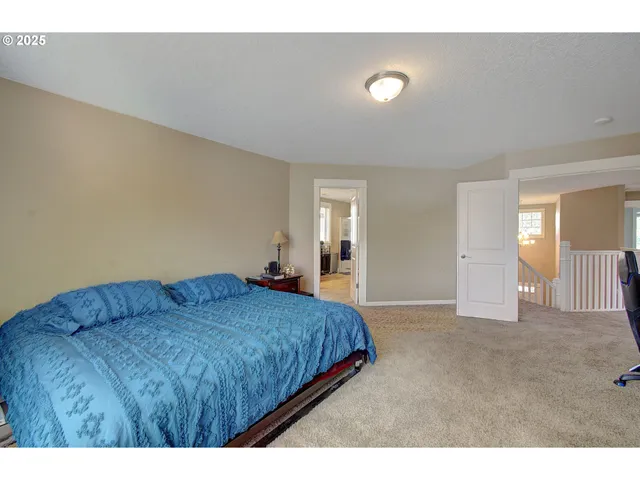 a bedroom with a bed and furniture