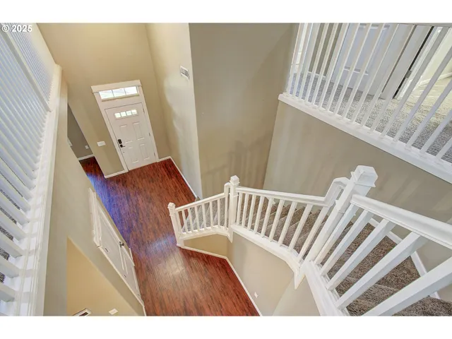 a view of entryway with a window and wooden floor