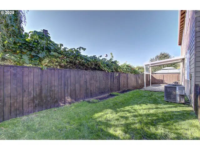 a view of a garage with rack and bicycle
