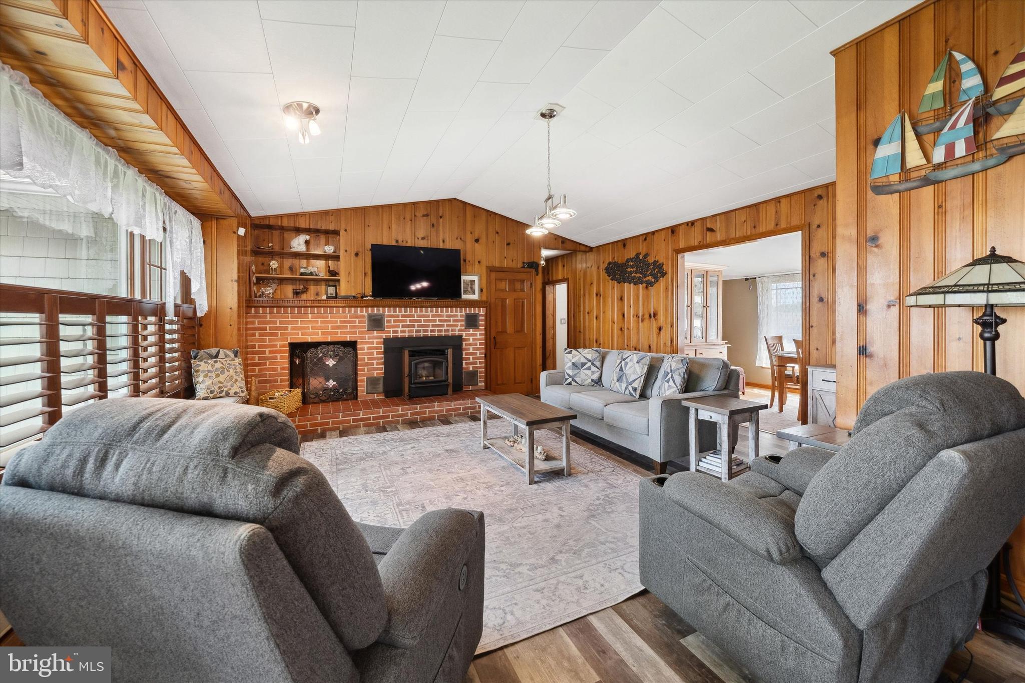 48 Bluff Road Earleville, MD 21919 - Photo 19 of 58 a living room with furniture a fireplace and a large window