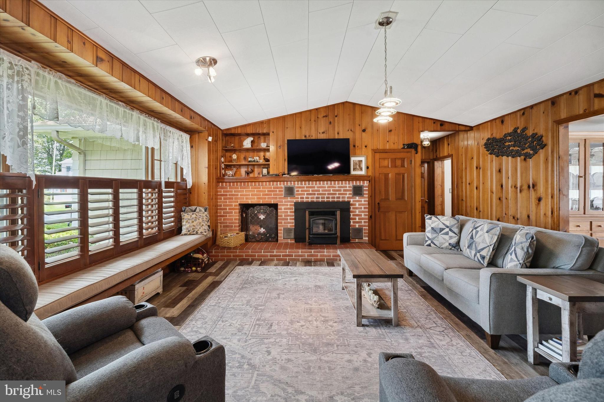 48 Bluff Road Earleville, MD 21919 - Photo 20 of 58 a living room with furniture a flat screen tv and a fireplace