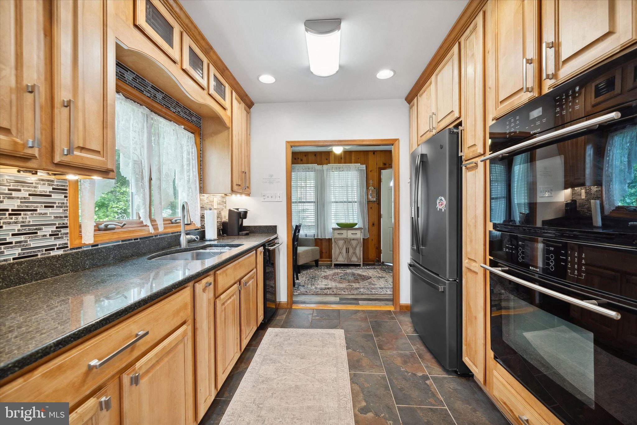 48 Bluff Road Earleville, MD 21919 - Photo 27 of 58 a kitchen with stainless steel appliances a sink stove and cabinets