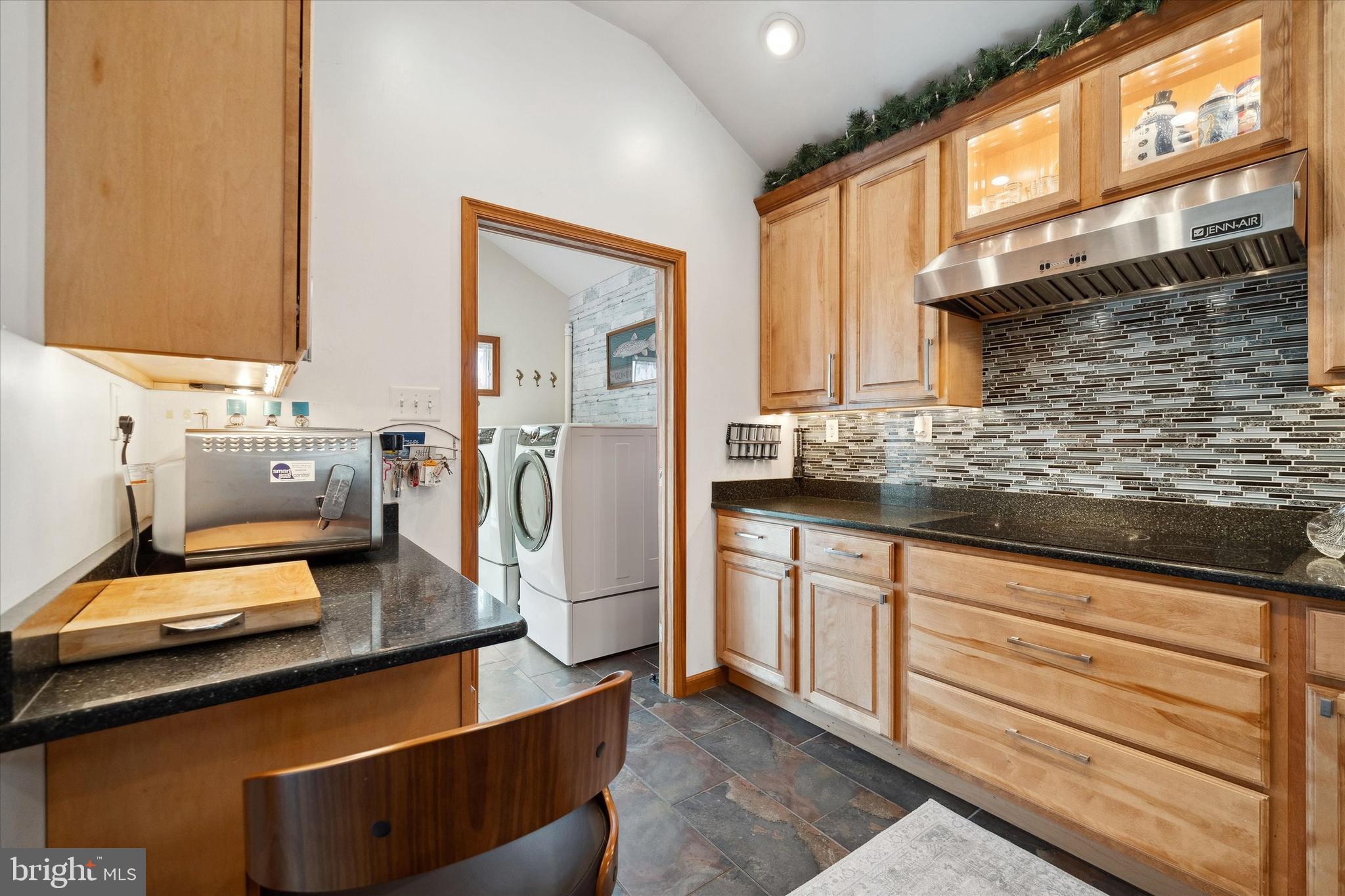 48 Bluff Road Earleville, MD 21919 - Photo 29 of 58 a kitchen with stainless steel appliances granite countertop a sink stove and refrigerator