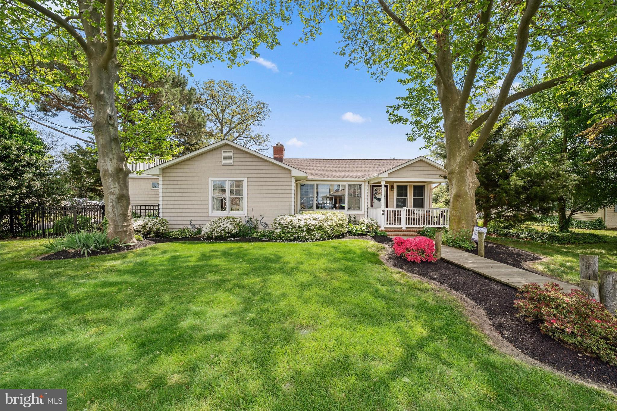 48 Bluff Road Earleville, MD 21919 - Photo 3 of 58 a view of a house with a big yard potted plants and large tree
