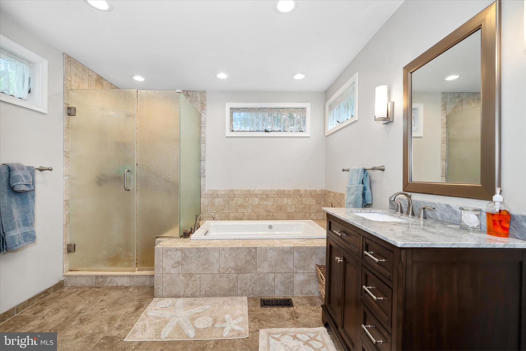 48 Bluff Road Earleville, MD 21919 - Photo 35 of 58 a bathroom with a tub sink and mirror
