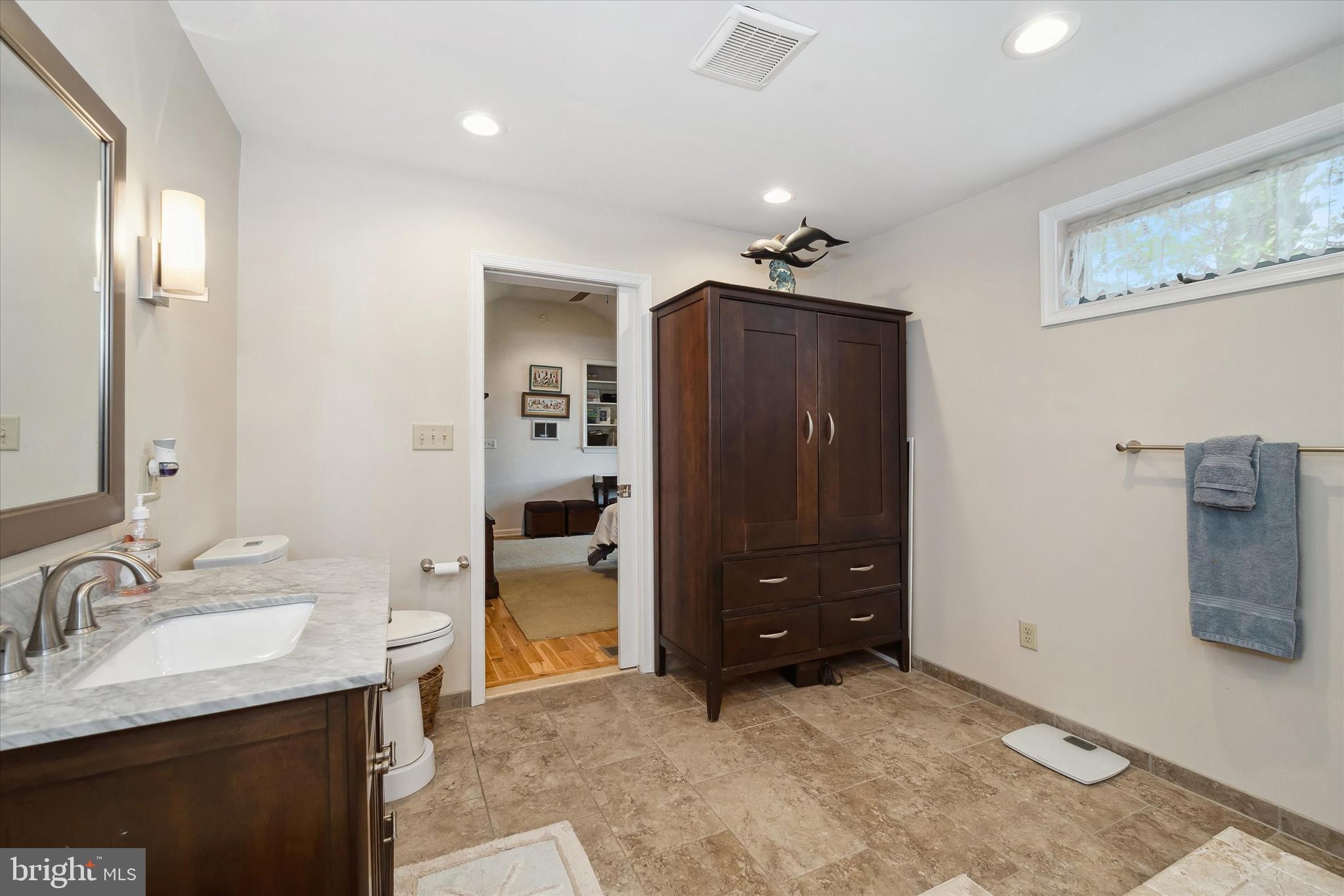 48 Bluff Road Earleville, MD 21919 - Photo 37 of 58 a bathroom with a sink and a mirror