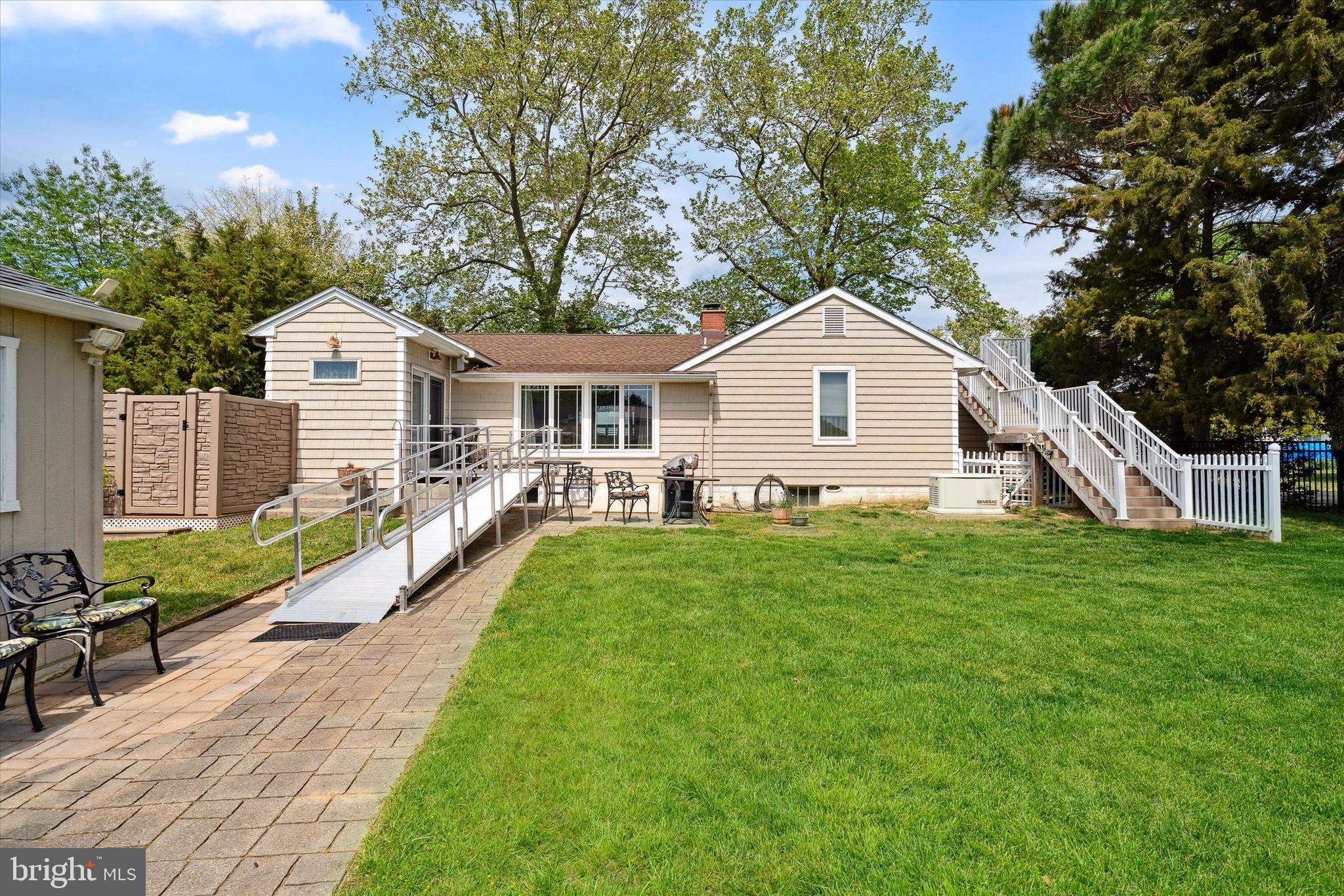 48 Bluff Road Earleville, MD 21919 - Photo 44 of 58 a front view of a house with a garden and yard