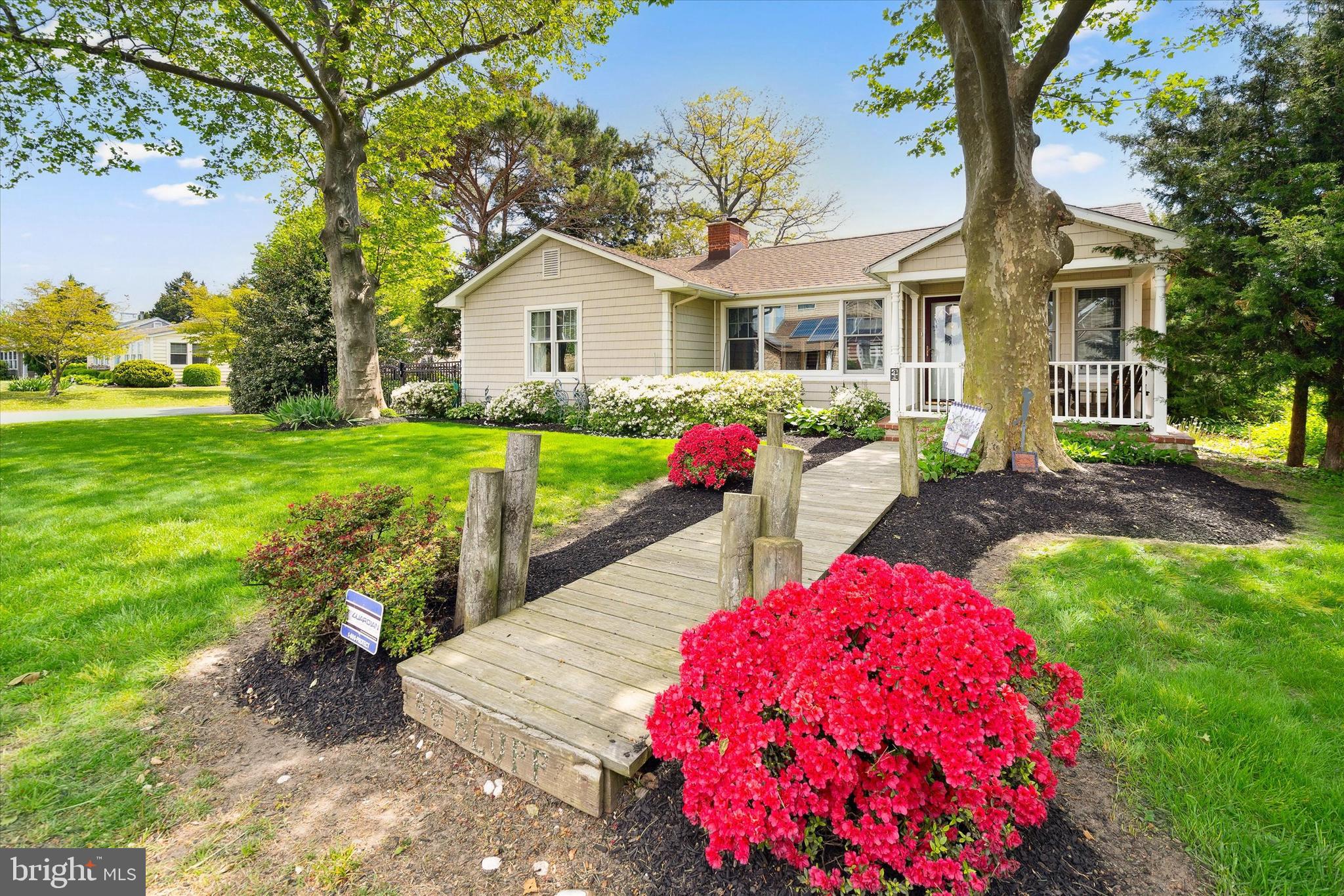 48 Bluff Road Earleville, MD 21919 - Photo 5 of 58 a front view of a house with backyard and sitting area