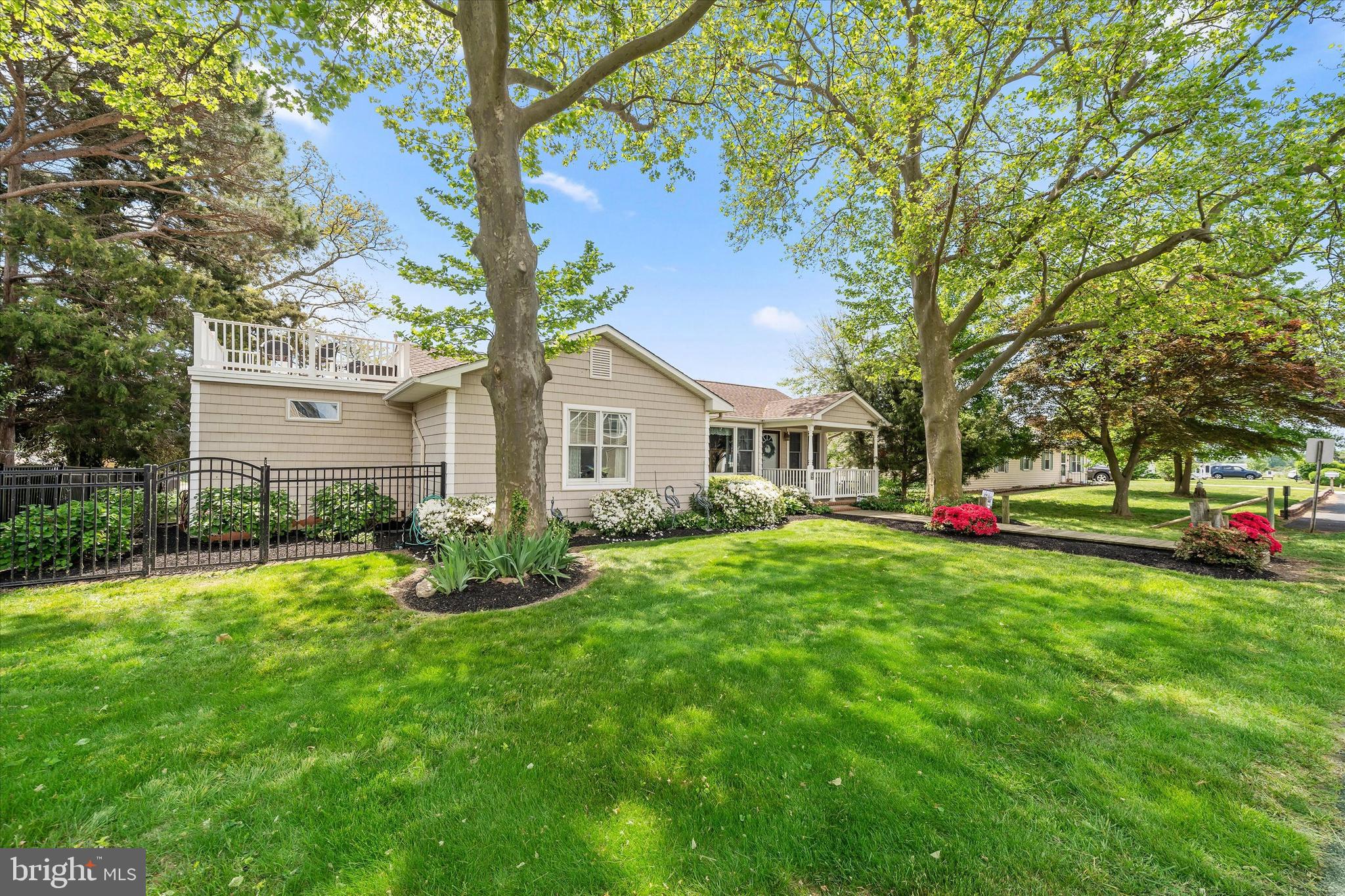 48 Bluff Road Earleville, MD 21919 - Photo 6 of 58 a front view of a house with a yard and trees