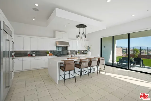 a view of living room with granite countertop furniture and a fireplace