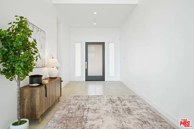 a view of living room with furniture and floor to ceiling window