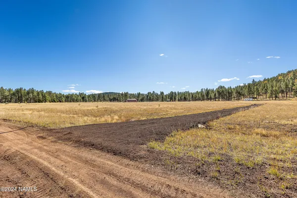 a view of lake with mountain in background