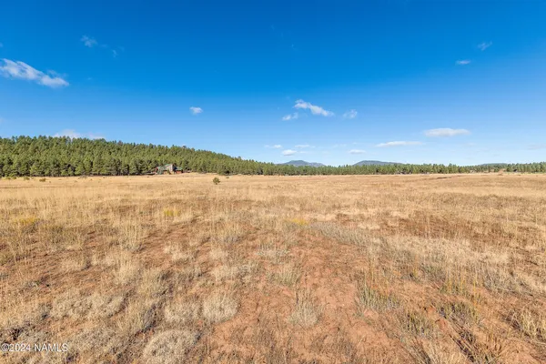 a view of mountain with sunset