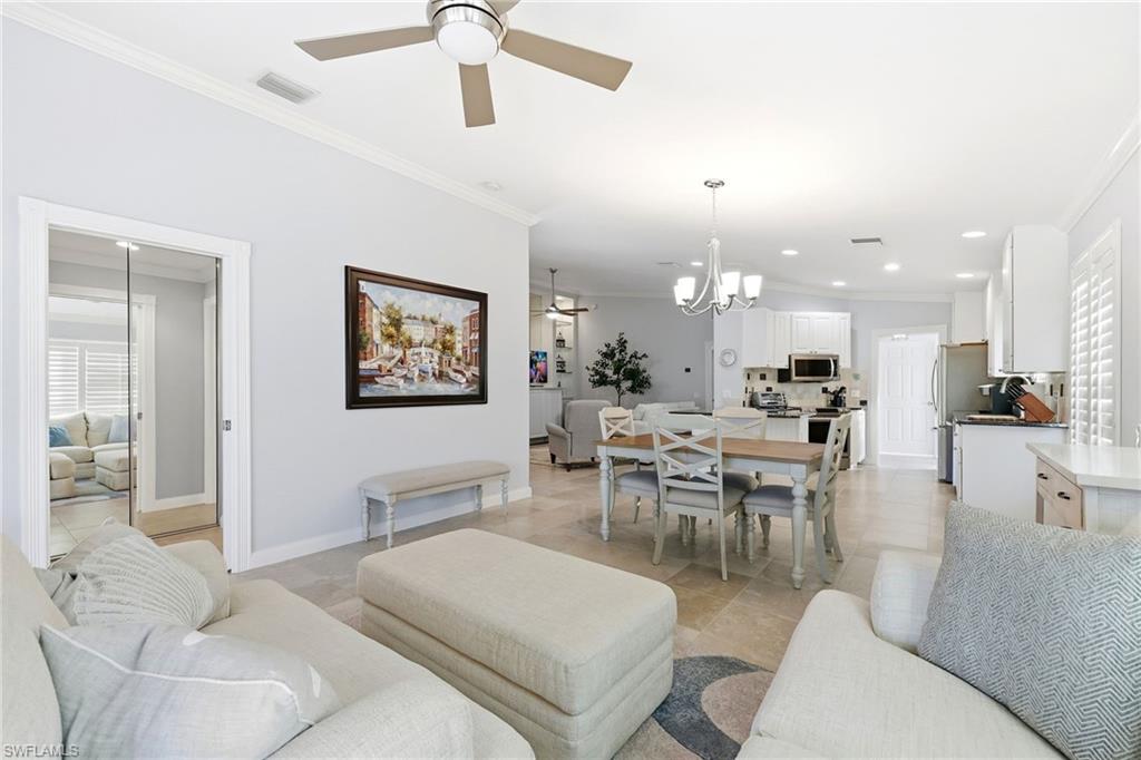 7527 Novara Court Naples, FL 34114 - Photo 13 of 50 View form Open Den/Living Room to Dining/Kitchen area