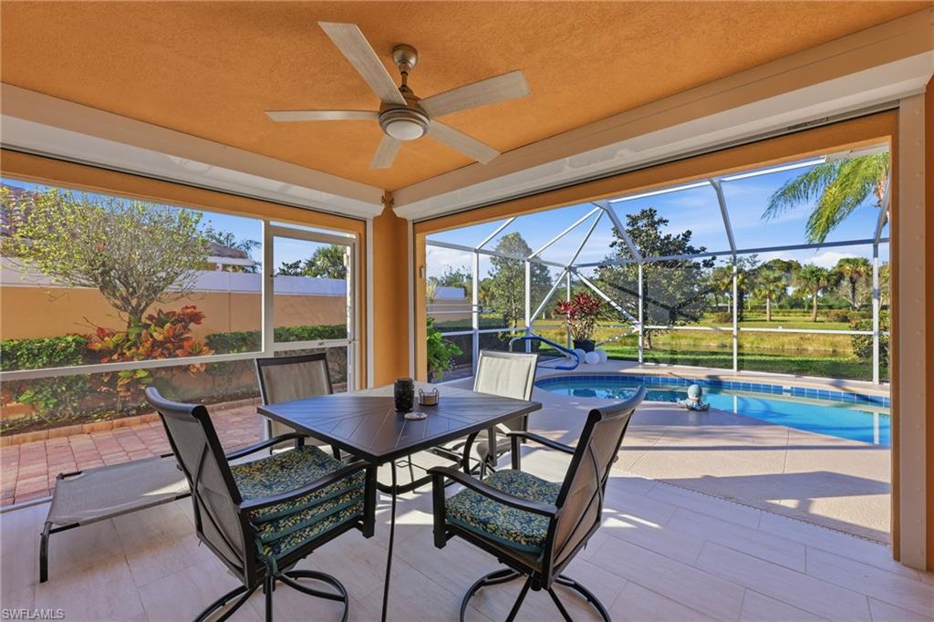 7527 Novara Court Naples, FL 34114 - Photo 16 of 50 Covered Lanai , with custom tile floor, electric roll downs.