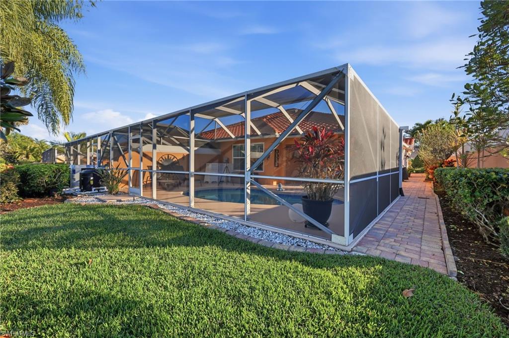 7527 Novara Court Naples, FL 34114 - Photo 18 of 50 Screened-in Lanai/Pool with paved sideways