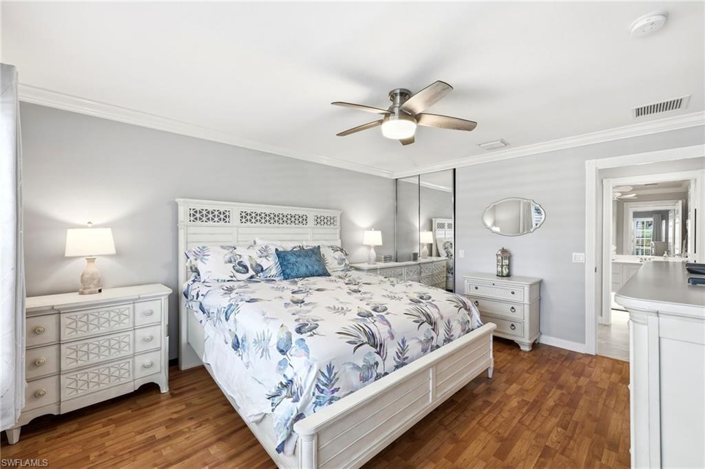 7527 Novara Court Naples, FL 34114 - Photo 23 of 50 Master Bedroom with hardwood floor