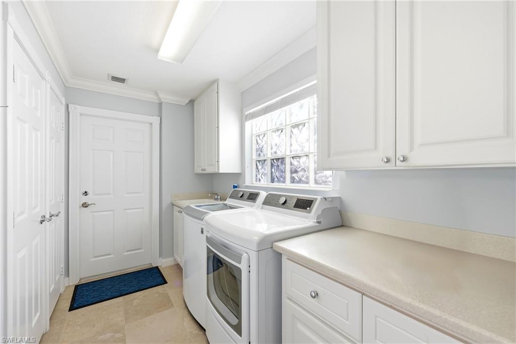 7527 Novara Court Naples, FL 34114 - Photo 29 of 50 Landry with sin, washer & dryer and access to the garage.