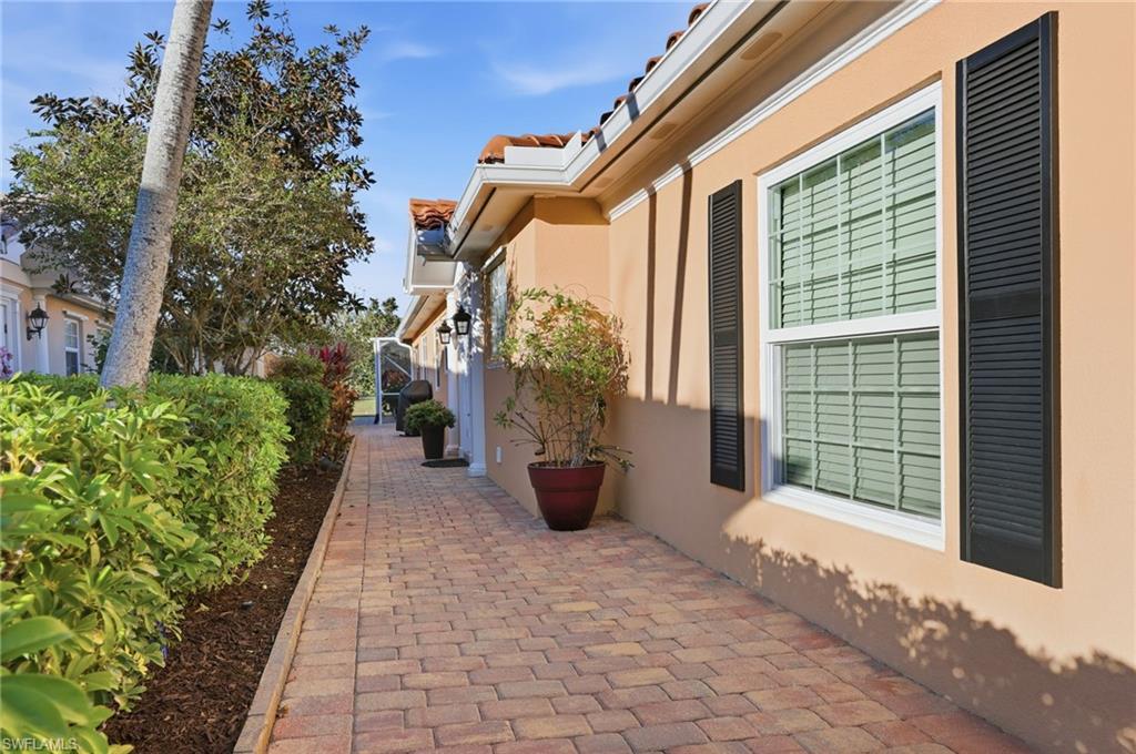 7527 Novara Court Naples, FL 34114 - Photo 4 of 50 extended wide paver side entry walkway