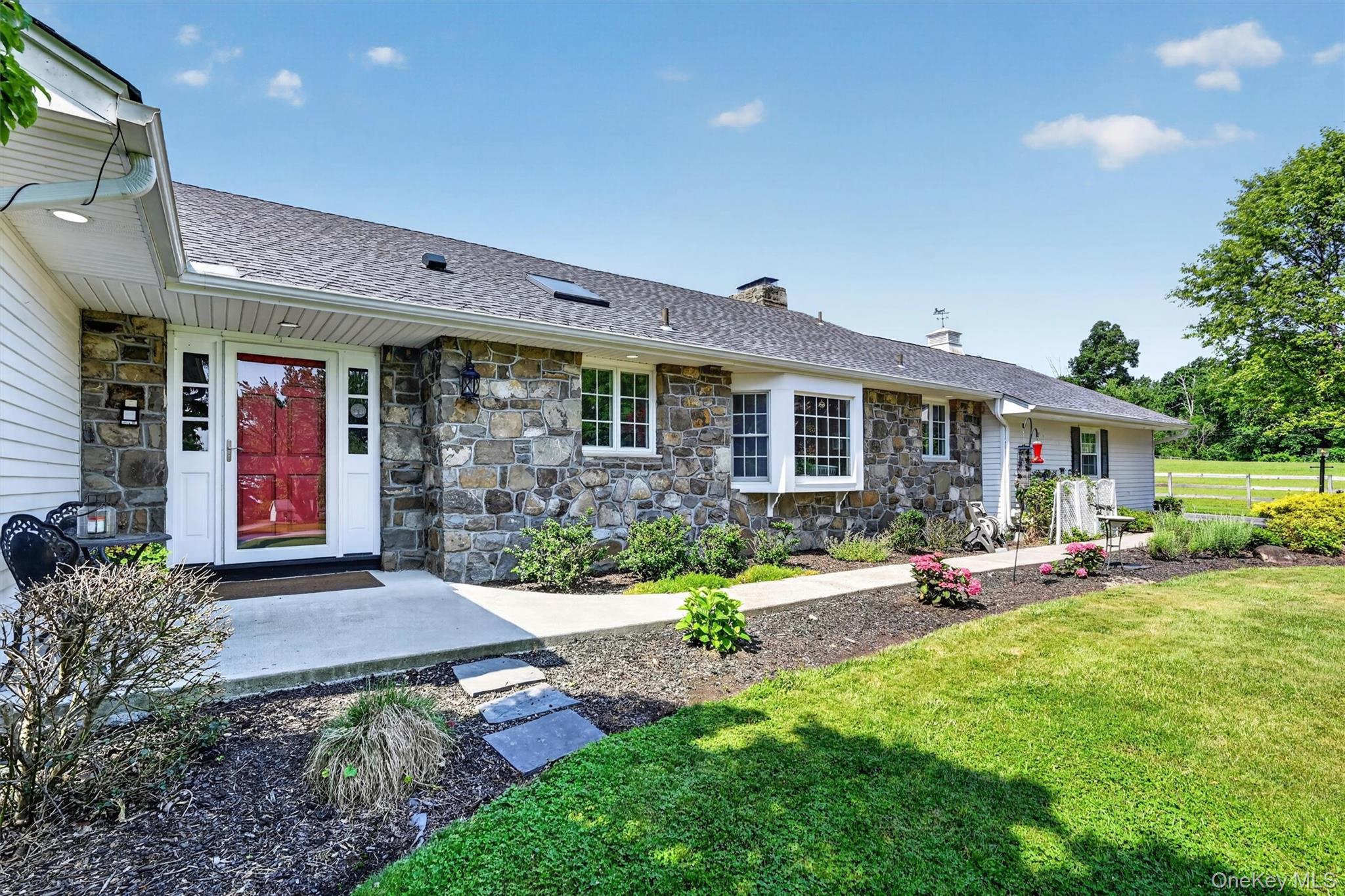5 Hedges Road Warwick, NY 10990 - Photo 5 of 48 A closer look at the charming stone exterior, red front door, and manicured landscaping that give 5 Hedges Road its warm and timeless curb appeal.