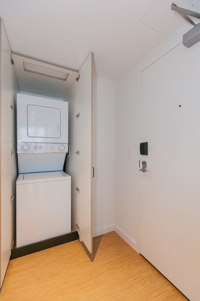 Undisclosed Address Chicago, IL 60642 - Photo 9 of 9 a utility room with dryer and washer