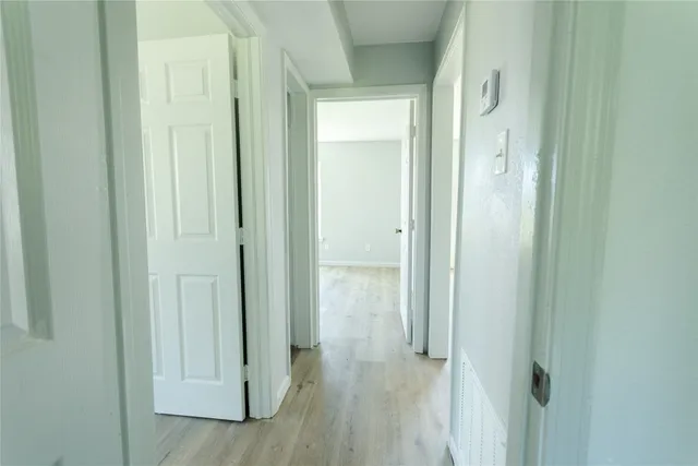a view of a bathroom from a hallway